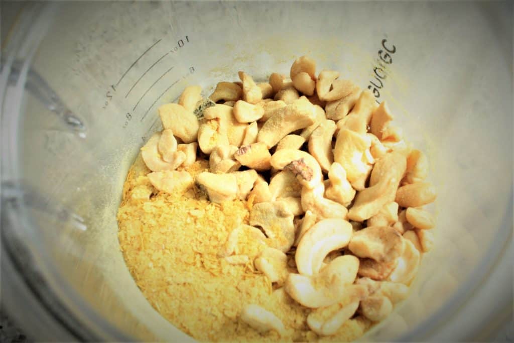 vegan cashew parmesan ingredients in a small blender. 