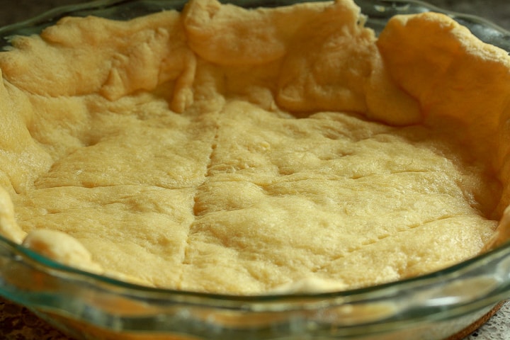 taco pie crust with crescent rolls in a pie dish. 