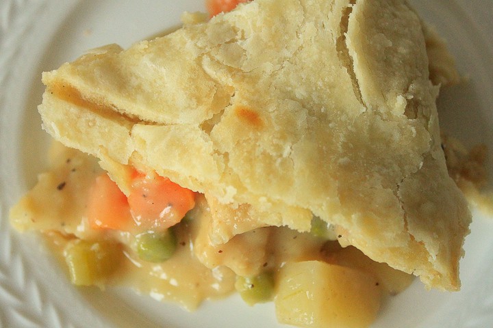 vegan chicken pot pie slice on a white plate. 