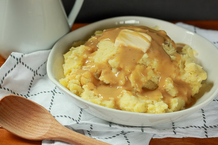 vegan mashed potatoes in a white dish. 