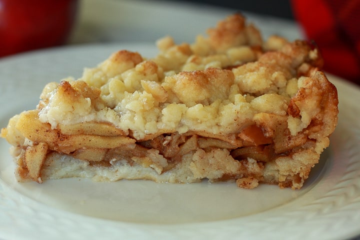vegan apple pie slice on a white plate. 