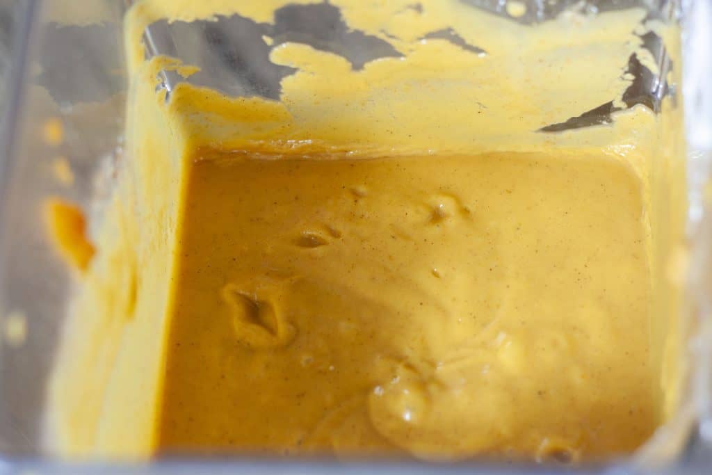 vegan pumpkin pie filling after being blended in the blender container.