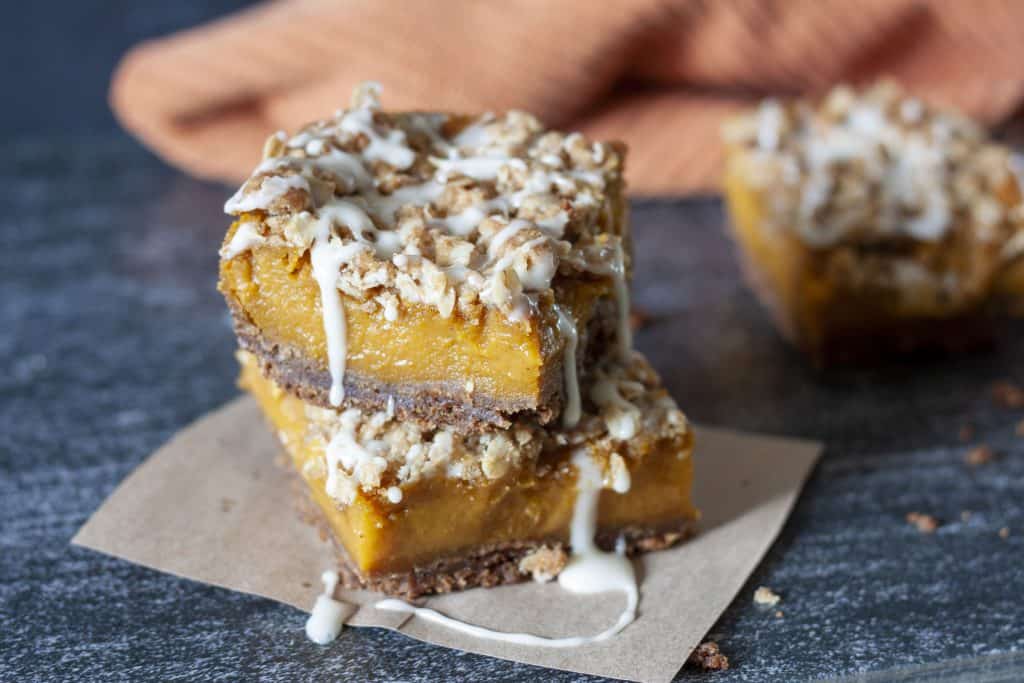 vegan pumpkin pie bars stacked. 