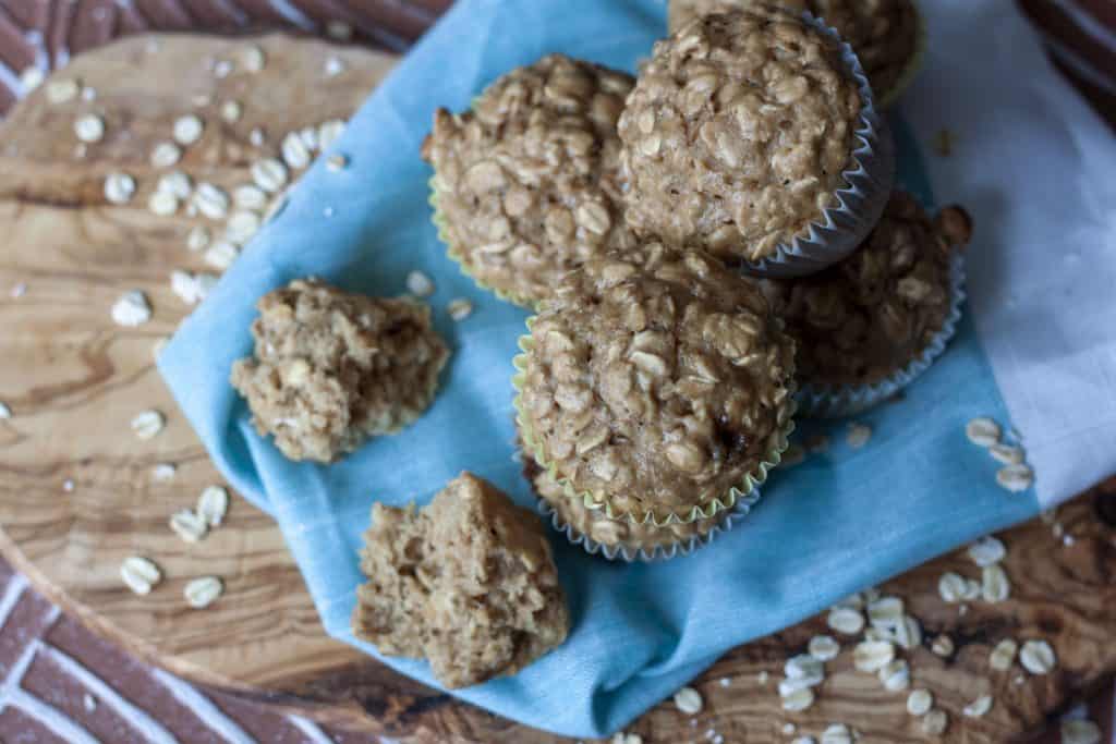 Easy Vegan Oatmeal Muffins piled above the head shot. 