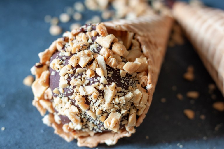 vegan ice cream drumstick on a black background. 