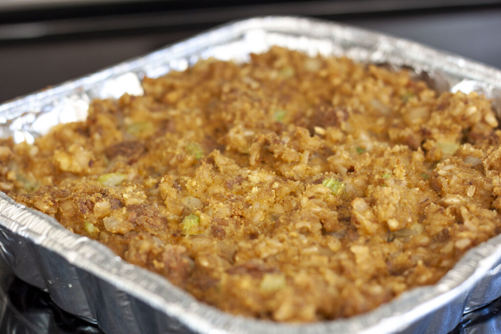 vegan cornbread stuffing in a silver 8x8 pan cooked. 