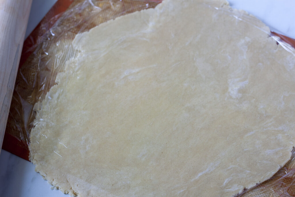 saran wrap on the dough for rolling out pie crust flat.
