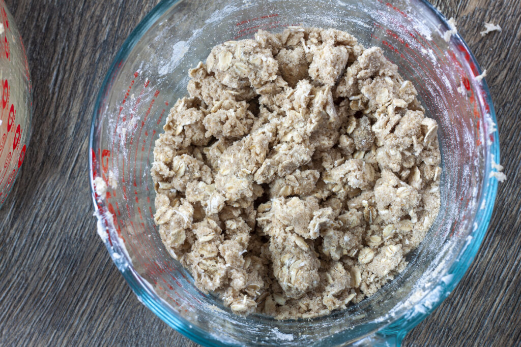 vegan apple pie crumble topping in a glass bowl.