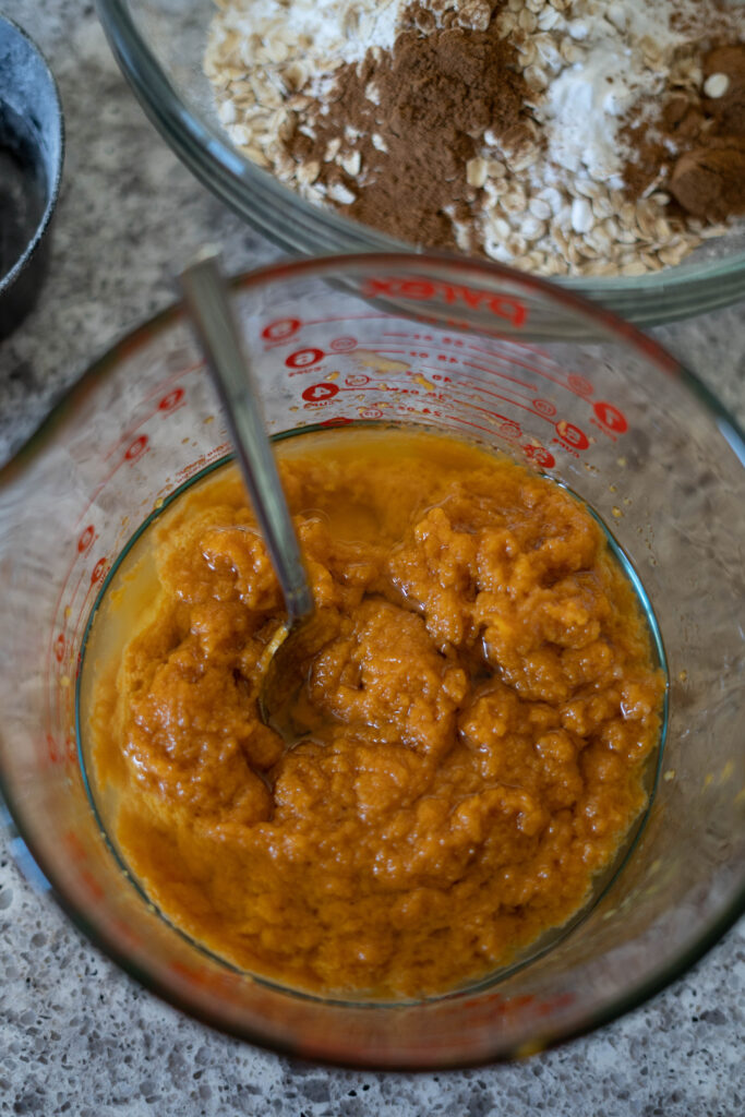 wet ingredients for vegan pumpkin muffins in a bowl.