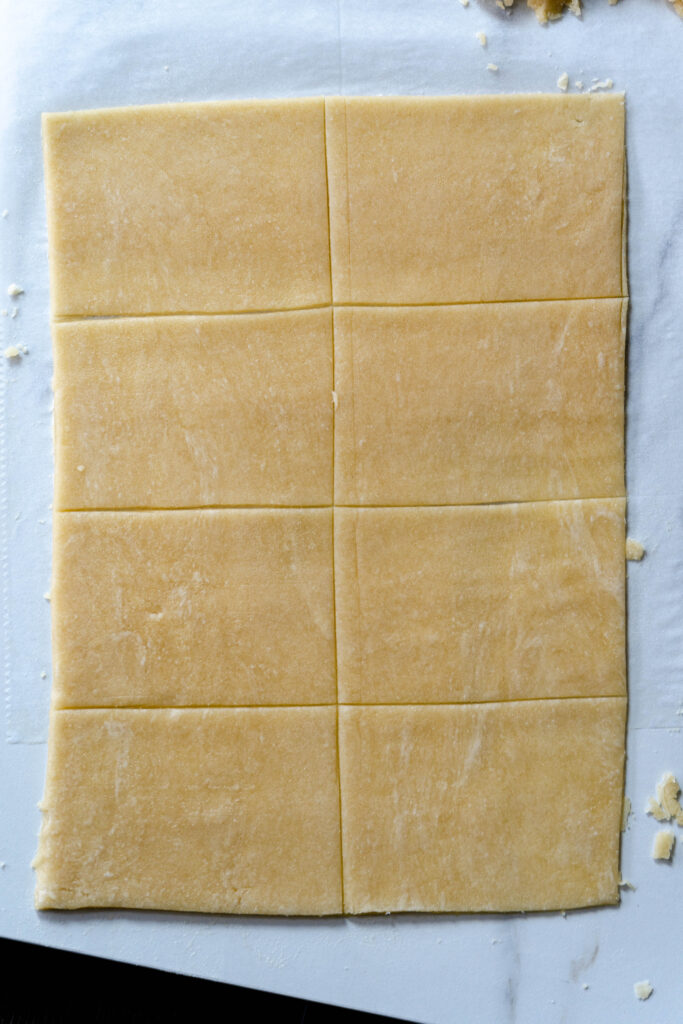 cutting the vegan pop tart dough evenly a rectangle with 8 smaller rectangles. 
