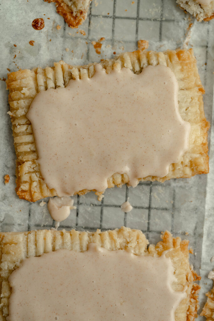 frosted vegan pop tarts on parchment paper. 