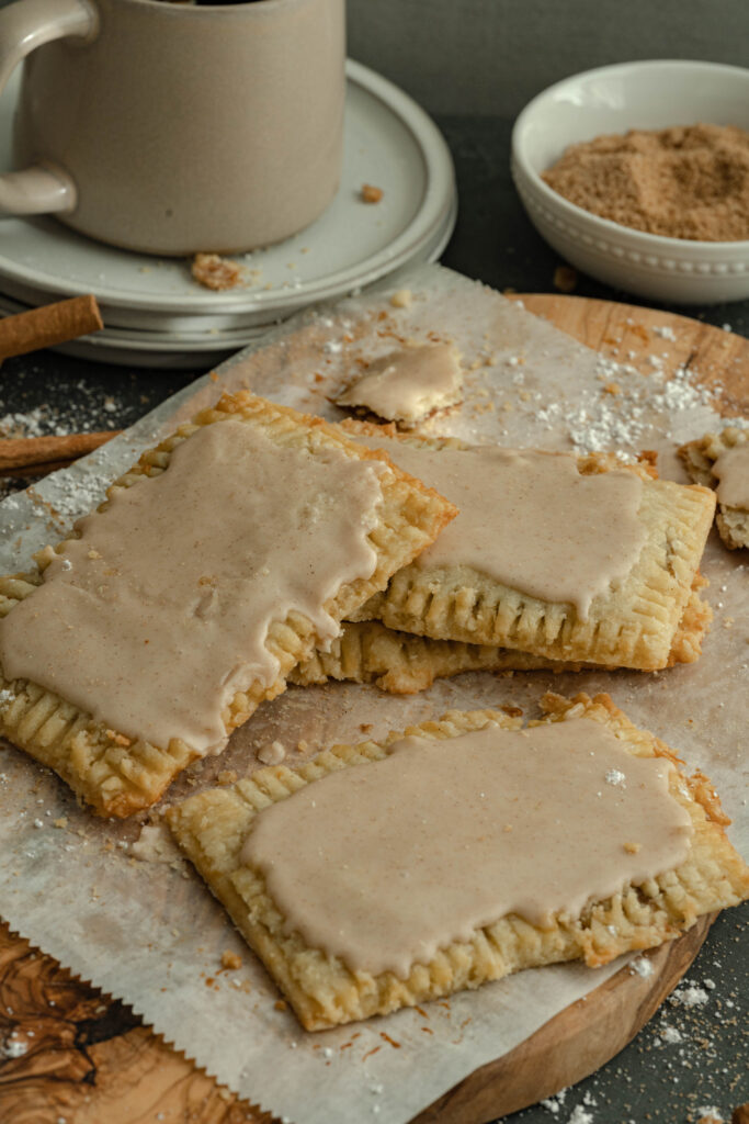 vegan brown sugar poptarts stacked on parchment paper. 