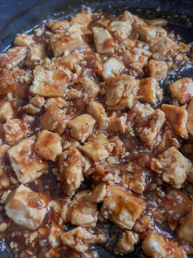 tofu cooking in sauce