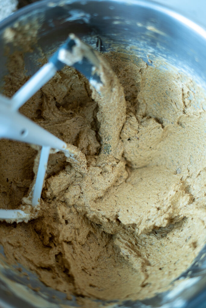 vegan gingerbread cookie dough in a metal mixing bowl. 