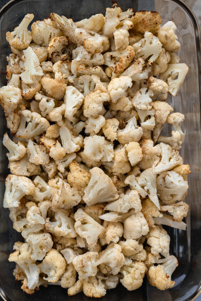 roasted cauliflower in a glass pan. 