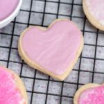 pink sugar cookie on a cooling rack.