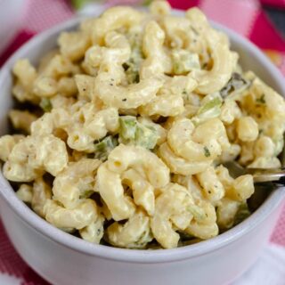 vegan macaroni salad close up shot in a grey bowl.