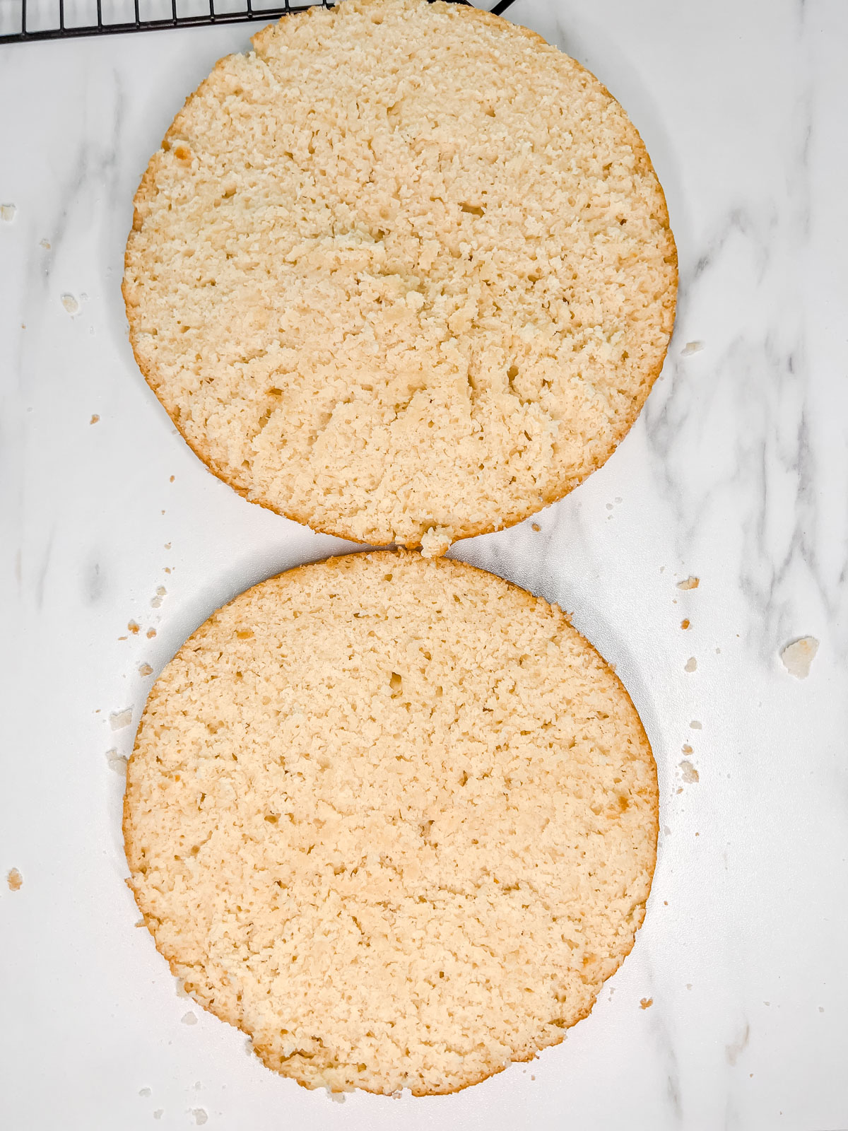 A vegan biscuit cake cut in half with both slices open cut. 