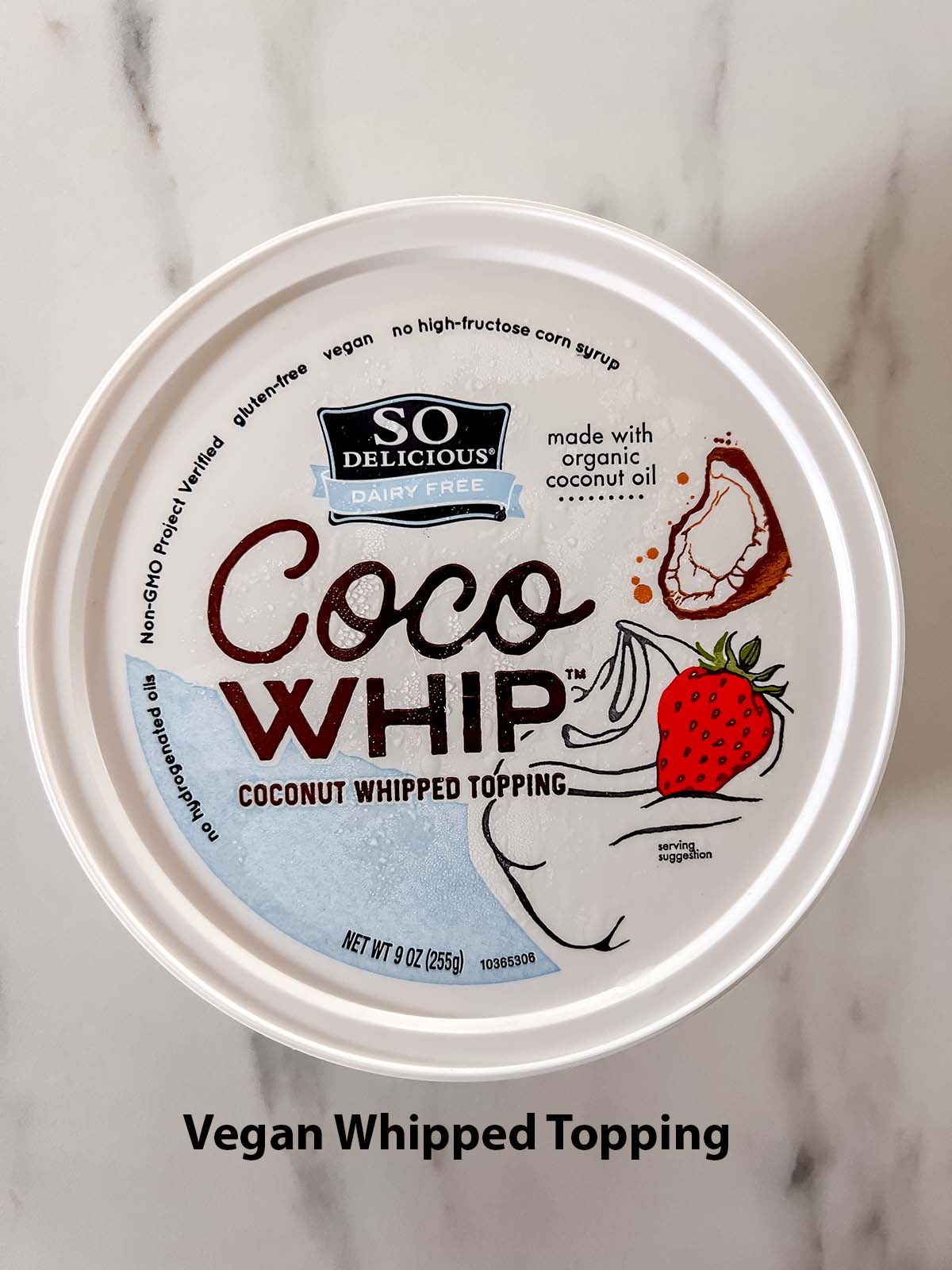 Vegan whipped topping with a black writing label. 