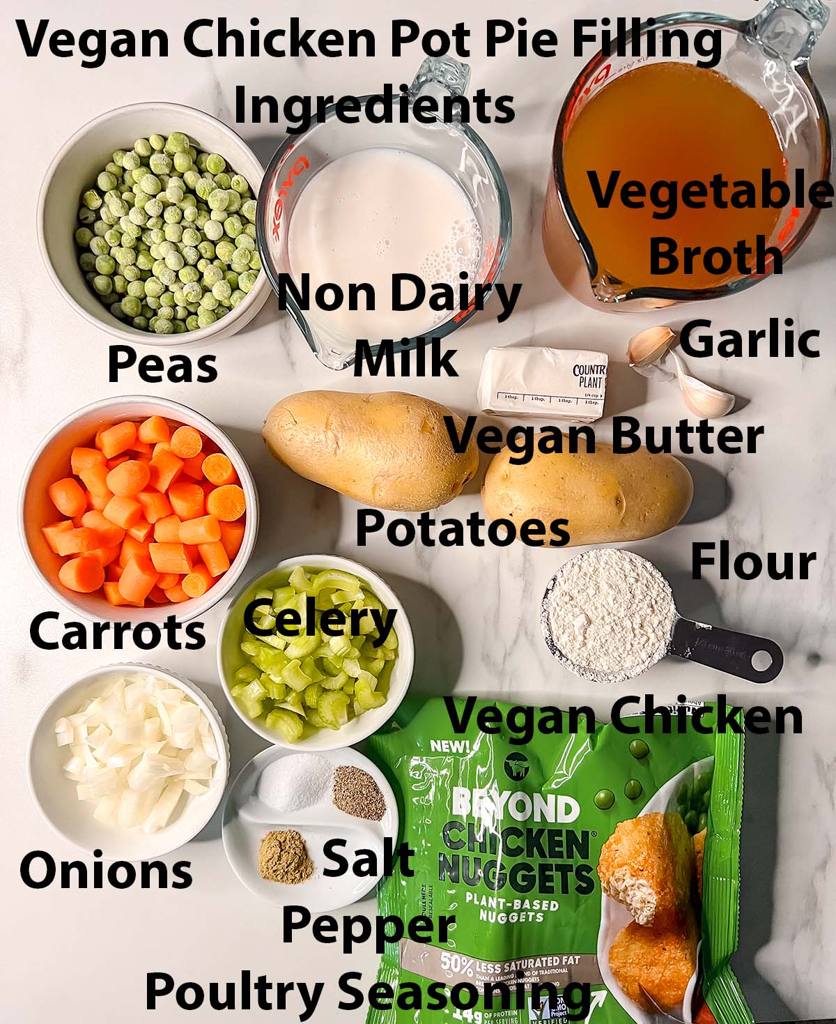 Vegan Chicken pot pie filling ingredients in small bowls with black labels. 