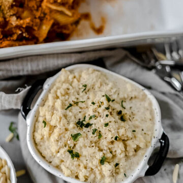 Vegan ricotta cheese in a small square container.